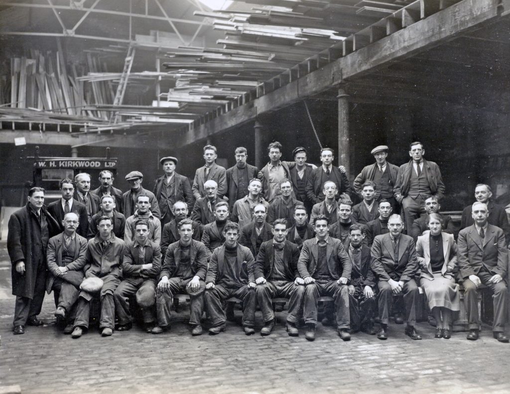 1930s black and white photo of W.H. Kirkwood staff