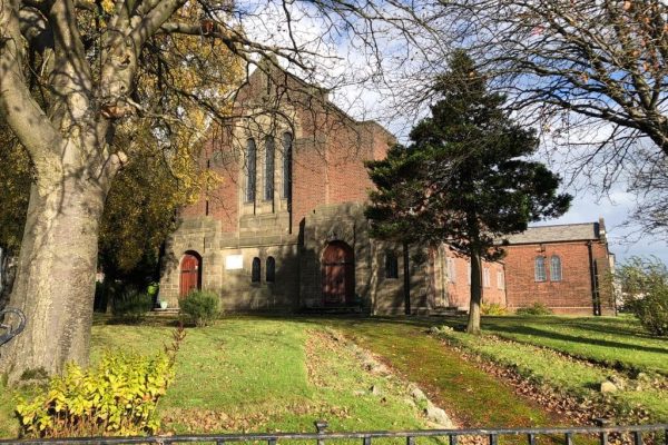 The outside of Carntyne Parish Church on a sunny day.